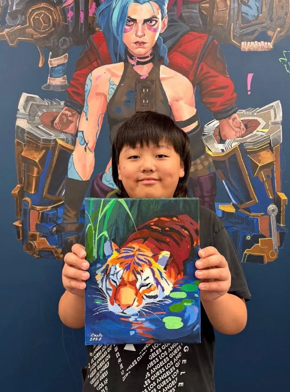 Student holding a finished piece
