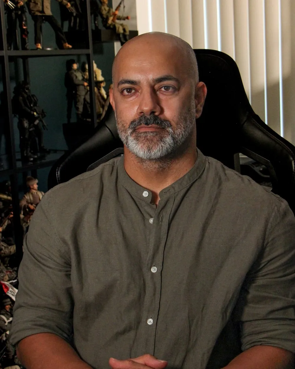 Vahid Bahmani, art director and concept artist, seated in his studio